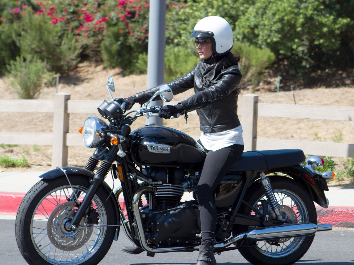 Leather clad Olivia Munn takes a spin on her motorbike in Malibu, CA.